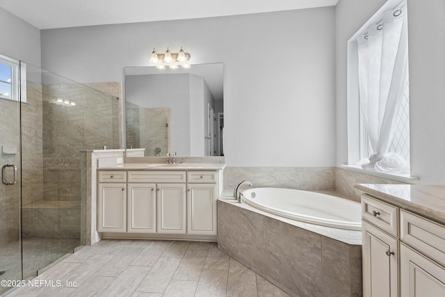 2936 Brettungar Dr, Jacksonville, FL 32246 - bathroom with vanity, a bath, and a stall shower