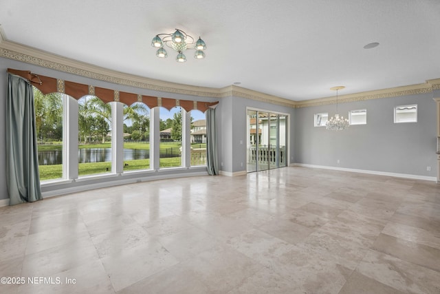 2936 Brettungar Dr, Jacksonville, FL 32246 - empty room featuring a chandelier, plenty of natural light, a water view, and ornamental molding