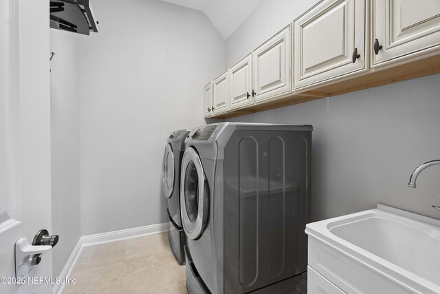 2936 Brettungar Dr, Jacksonville, FL 32246 - laundry room with separate washer and dryer, cabinet space, and light tile patterned floors