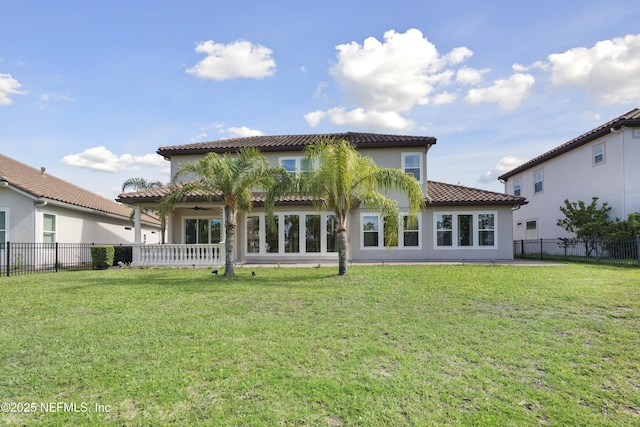 2936 Brettungar Dr, Jacksonville, FL 32246 - back of property with a ceiling fan, a tiled roof, a fenced backyard, and stucco siding