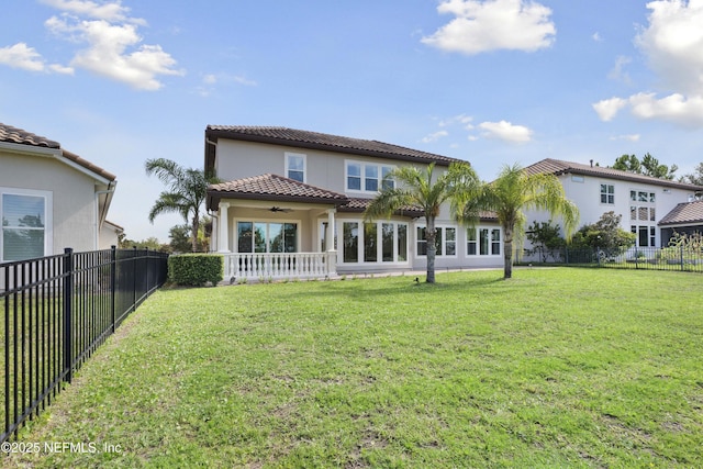 2936 Brettungar Dr, Jacksonville, FL 32246 - rear view of house featuring a ceiling fan, a fenced backyard, stucco siding, and a tiled roof