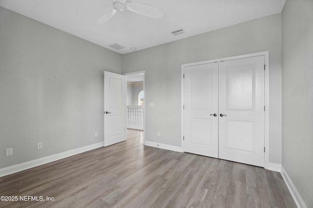 2936 Brettungar Dr, Jacksonville, FL 32246 - unfurnished bedroom featuring wood finished floors, a closet, and ceiling fan