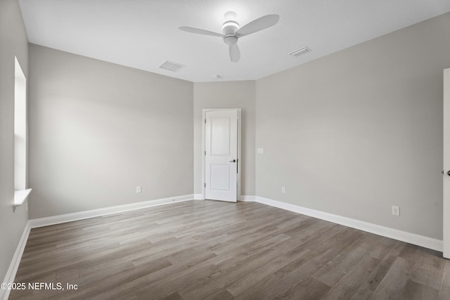 2936 Brettungar Dr, Jacksonville, FL 32246 - spare room with wood finished floors and a ceiling fan