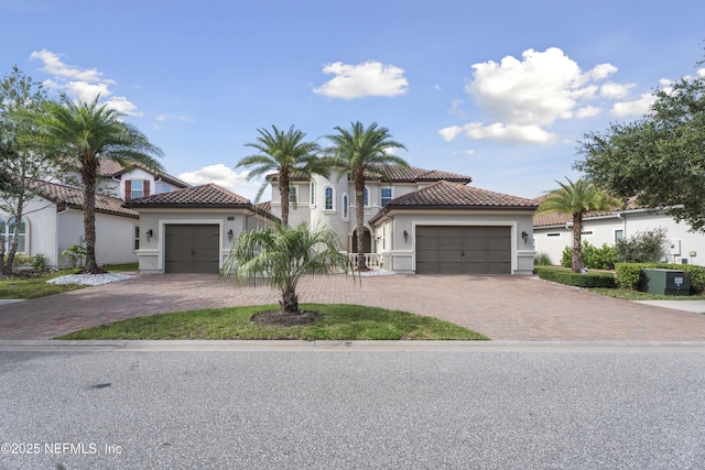2936 Brettungar Dr, Jacksonville, FL 32246 - mediterranean / spanish house with a tile roof, stucco siding, and driveway
