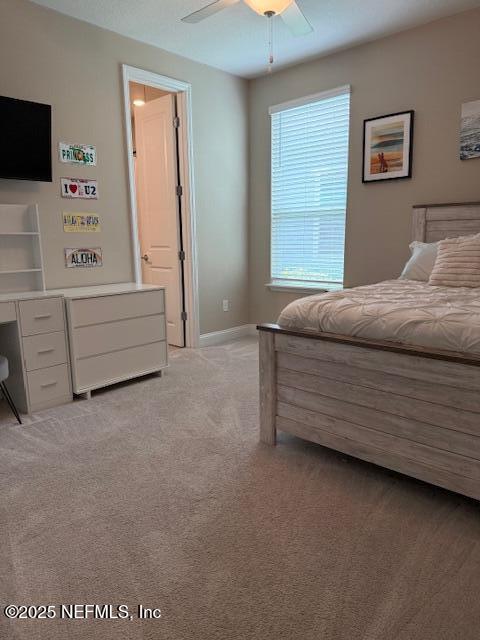 296 Latrobe Ave, Saint Augustine, FL 32095 - bedroom with light colored carpet and ceiling fan