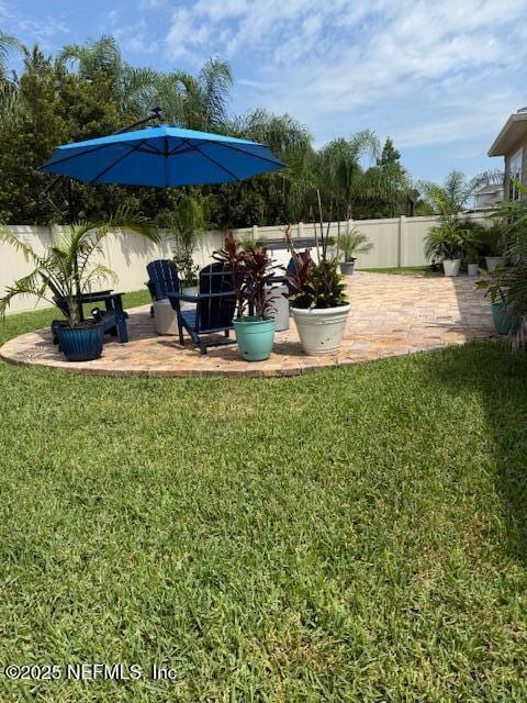 296 Latrobe Ave, Saint Augustine, FL 32095 - fenced backyard featuring a patio area