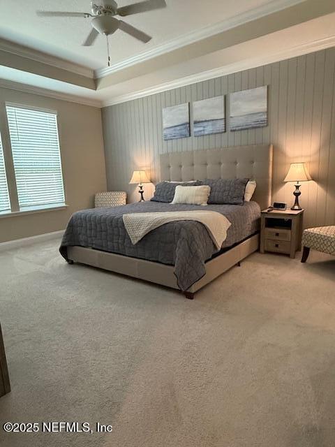 296 Latrobe Ave, Saint Augustine, FL 32095 - bedroom with crown molding, carpet, a tray ceiling, and a ceiling fan