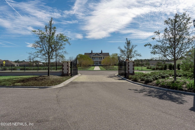 296 Latrobe Ave, Saint Augustine, FL 32095 - view of asphalt road with curbs and a gated entry