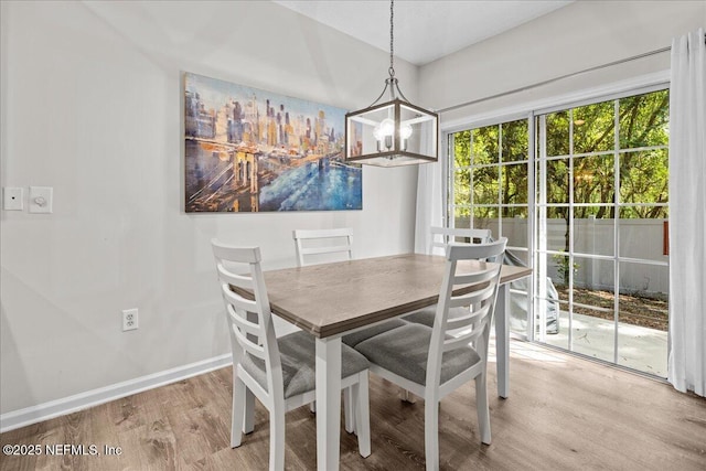 1515 Landau Rd, Jacksonville, FL 32225 - dining room featuring light wood-style flooring and a chandelier