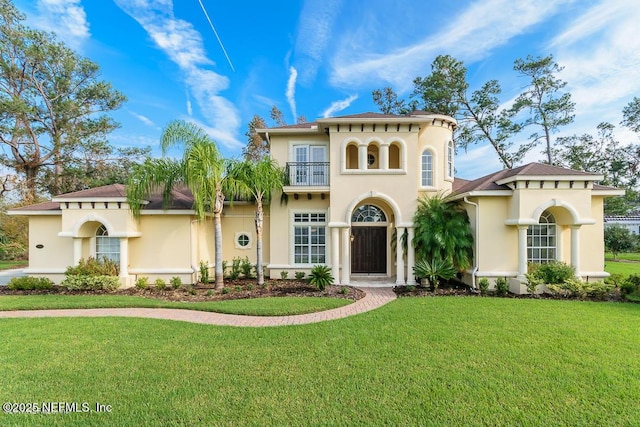 136 Strong Branch Dr, Ponte Vedra Beach, FL 32082 - mediterranean / spanish house featuring a balcony, stucco siding, and a front lawn