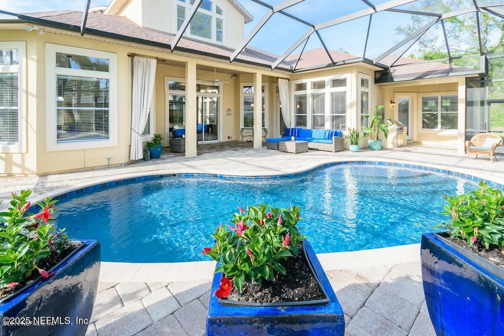 136 Strong Branch Dr, Ponte Vedra Beach, FL 32082 - swimming pool with an outdoor living space, a patio, and glass enclosure