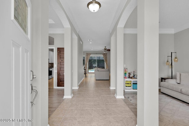 1728 Dartmoor Ln, Ponte Vedra, FL 32081 - foyer entrance featuring ornamental molding, a ceiling fan, arched walkways, and light tile patterned floors