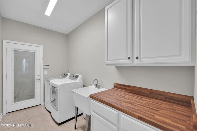 1728 Dartmoor Ln, Ponte Vedra, FL 32081 - laundry room with separate washer and dryer, cabinet space, and light tile patterned floors