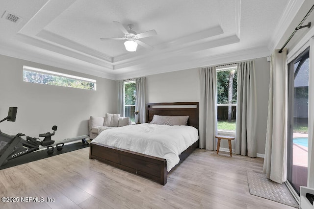 1728 Dartmoor Ln, Ponte Vedra, FL 32081 - bedroom featuring a raised ceiling, crown molding, wood finished floors, and ceiling fan