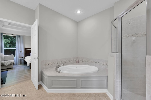 1728 Dartmoor Ln, Ponte Vedra, FL 32081 - bathroom featuring a bath, ensuite bath, a shower stall, and tile patterned floors