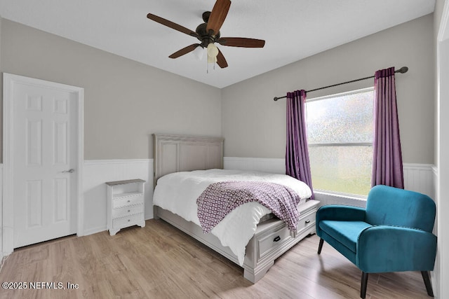 1728 Dartmoor Ln, Ponte Vedra, FL 32081 - bedroom featuring a wainscoted wall, light wood finished floors, and a ceiling fan