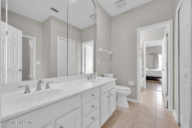 1728 Dartmoor Ln, Ponte Vedra, FL 32081 - bathroom with double vanity, ensuite bathroom, a closet, and tile patterned floors