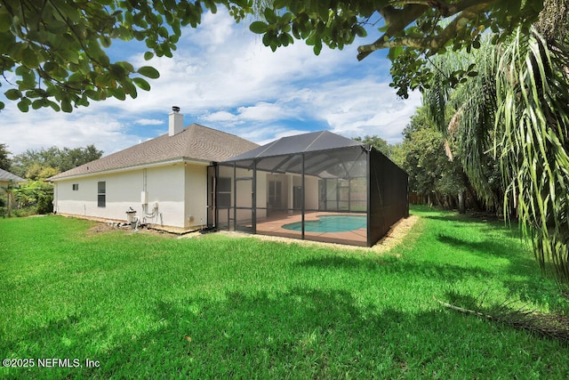 1728 Dartmoor Ln, Ponte Vedra, FL 32081 - back of house with a lawn, an outdoor pool, a chimney, and glass enclosure