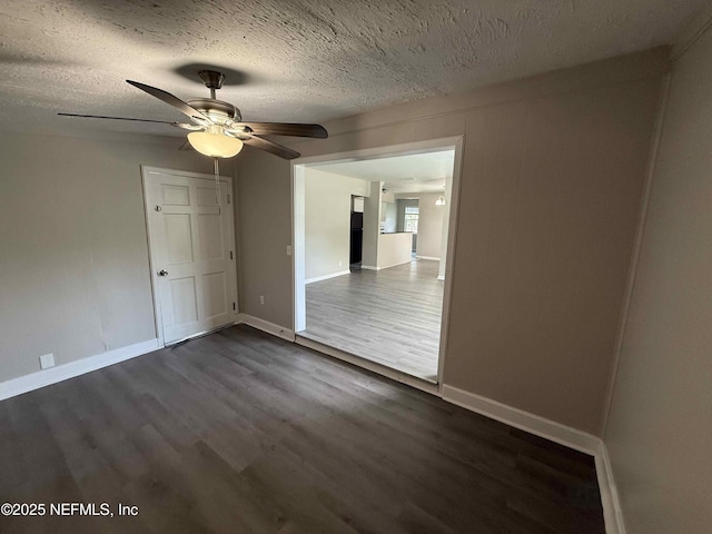 3421 Tarpon Dr, Jacksonville, FL 32277 - empty room featuring dark wood-style flooring, a ceiling fan, and a textured ceiling