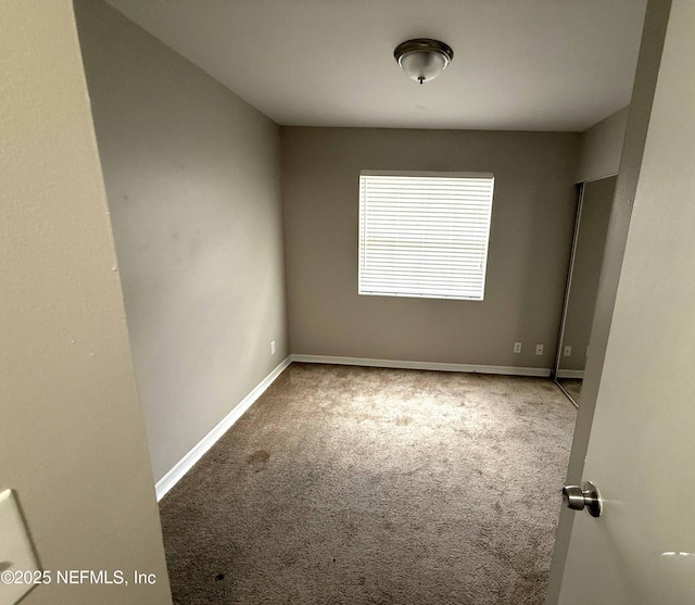 3421 Tarpon Dr, Jacksonville, FL 32277 - carpeted empty room featuring baseboards
