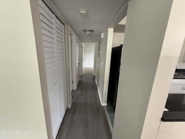 3421 Tarpon Dr, Jacksonville, FL 32277 - hall with dark wood-style flooring and baseboards