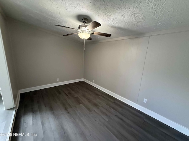 3421 Tarpon Dr, Jacksonville, FL 32277 - empty room with ceiling fan, dark wood finished floors, and a textured ceiling