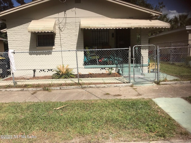 1555 W 17th St, Jacksonville, FL 32209 - view of property exterior featuring a gate