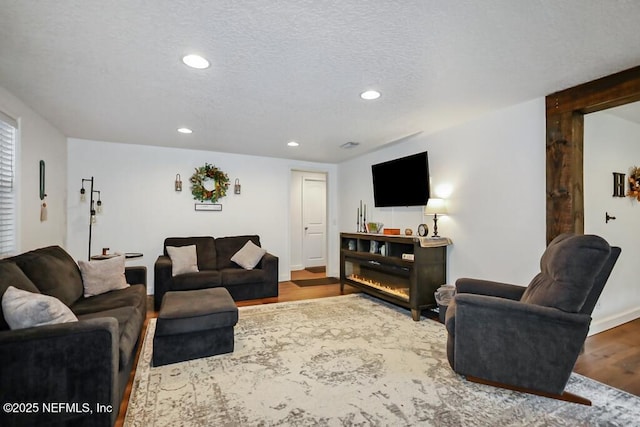 8360 Mudlake Rd, Macclenny, FL 32063 - living area with wood finished floors and recessed lighting