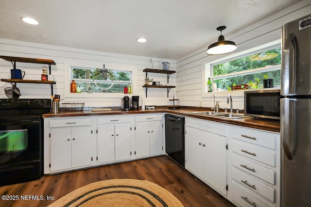 8360 Mudlake Rd, Macclenny, FL 32063 - kitchen with open shelves, black appliances, healthy amount of natural light, white cabinetry, and recessed lighting