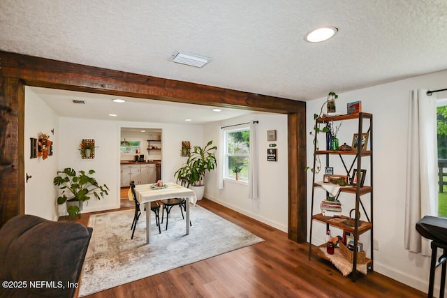 8360 Mudlake Rd, Macclenny, FL 32063 - dining area featuring a textured ceiling, plenty of natural light, recessed lighting, dark wood-style flooring, and beamed ceiling