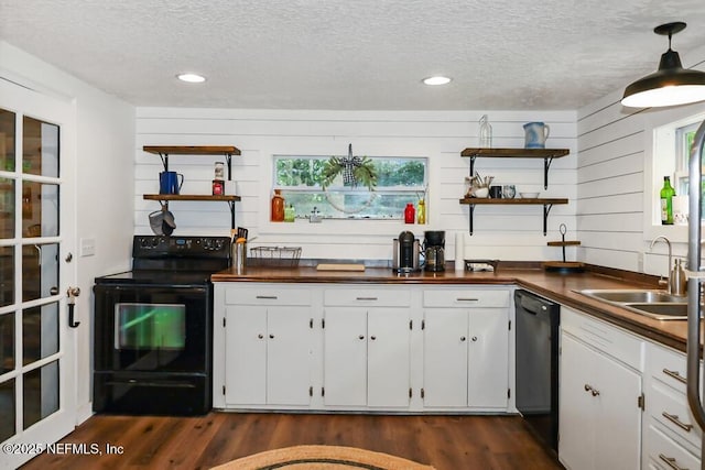 8360 Mudlake Rd, Macclenny, FL 32063 - kitchen featuring open shelves, black appliances, a textured ceiling, dark countertops, and recessed lighting