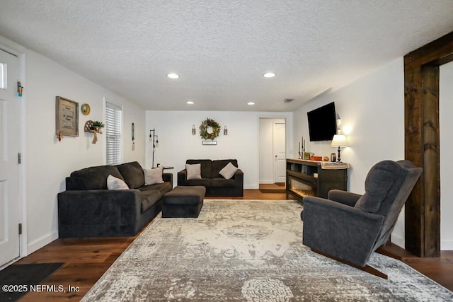 8360 Mudlake Rd, Macclenny, FL 32063 - living area with recessed lighting, dark wood-type flooring, and a textured ceiling