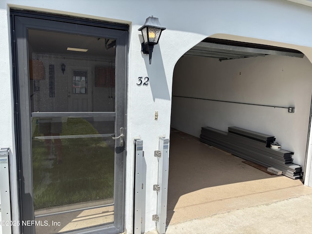 32 Ocean Palm Dr S Unit 320, Flagler Beach, FL 32136 - doorway to property with stucco siding