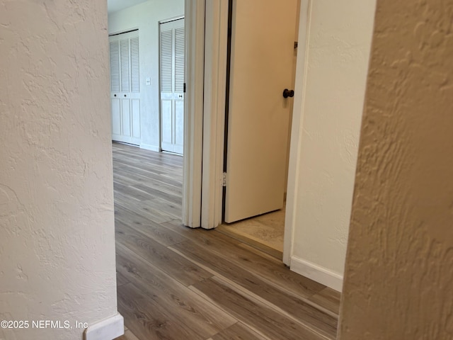 32 Ocean Palm Dr S Unit 320, Flagler Beach, FL 32136 - corridor featuring a textured wall and wood finished floors