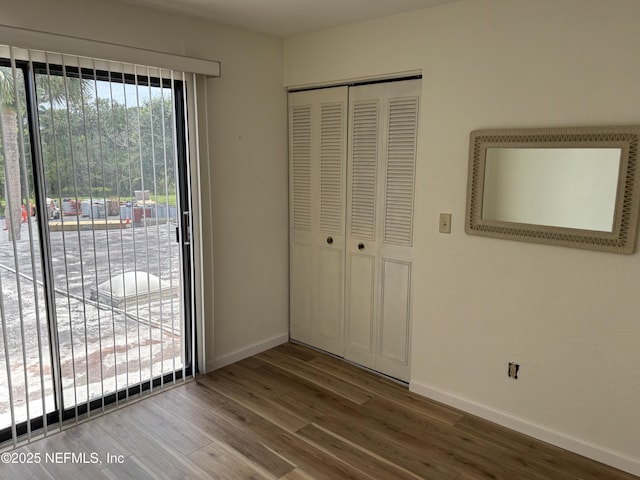 32 Ocean Palm Dr S Unit 320, Flagler Beach, FL 32136 - unfurnished bedroom featuring a closet and wood finished floors