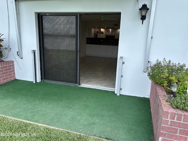 32 Ocean Palm Dr S Unit 320, Flagler Beach, FL 32136 - doorway to property featuring stucco siding