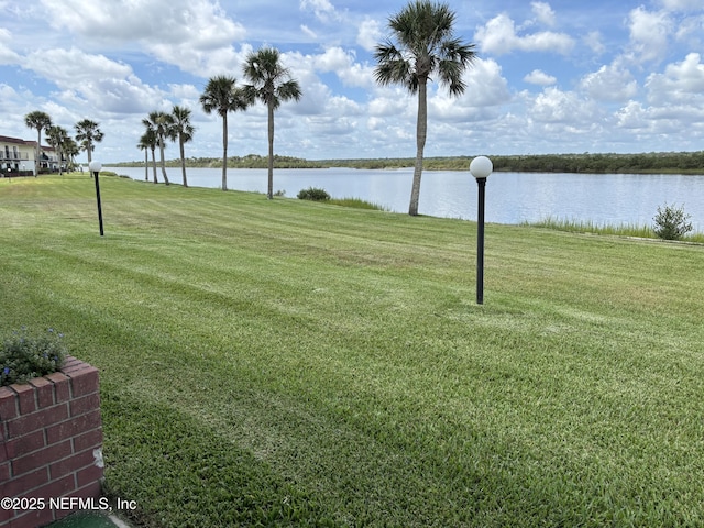 32 Ocean Palm Dr S Unit 320, Flagler Beach, FL 32136 - view of green lawn featuring a water view