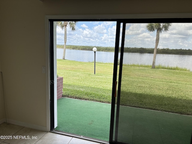 32 Ocean Palm Dr S Unit 320, Flagler Beach, FL 32136 - doorway to outside featuring a water view and light tile patterned flooring