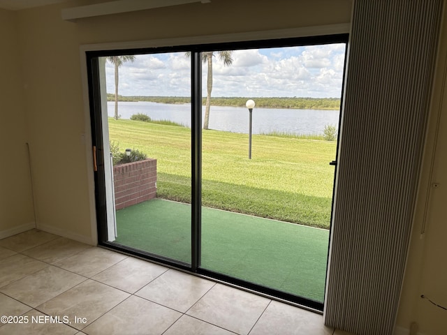 32 Ocean Palm Dr S Unit 320, Flagler Beach, FL 32136 - doorway featuring a water view and light tile patterned floors