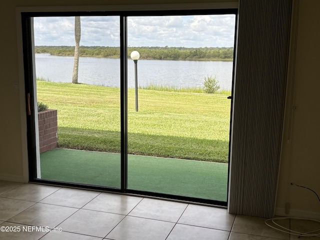32 Ocean Palm Dr S Unit 320, Flagler Beach, FL 32136 - doorway featuring a water view and light tile patterned flooring