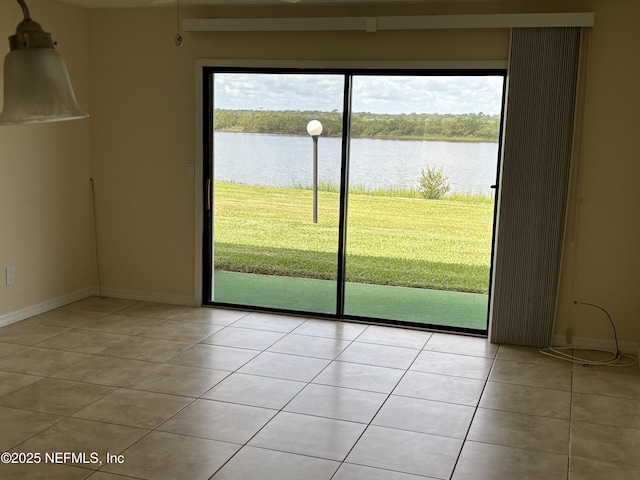 32 Ocean Palm Dr S Unit 320, Flagler Beach, FL 32136 - spare room featuring light tile patterned floors and a water view