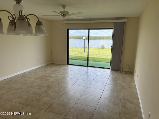 32 Ocean Palm Dr S Unit 320, Flagler Beach, FL 32136 - spare room featuring light tile patterned floors, a water view, and ceiling fan