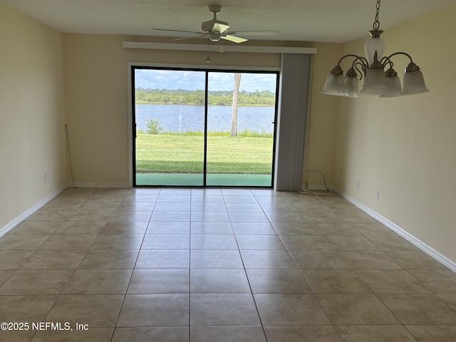 32 Ocean Palm Dr S Unit 320, Flagler Beach, FL 32136 - unfurnished room with a water view, a chandelier, light tile patterned floors, and a ceiling fan