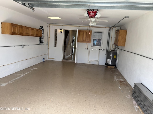 32 Ocean Palm Dr S Unit 320, Flagler Beach, FL 32136 - garage featuring a garage door opener, water heater, and a ceiling fan