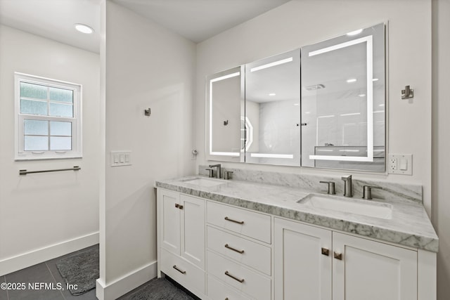 5566 Don Manuel Rd, Elkton, FL 32033 - bathroom featuring double vanity, a shower, and tile patterned flooring