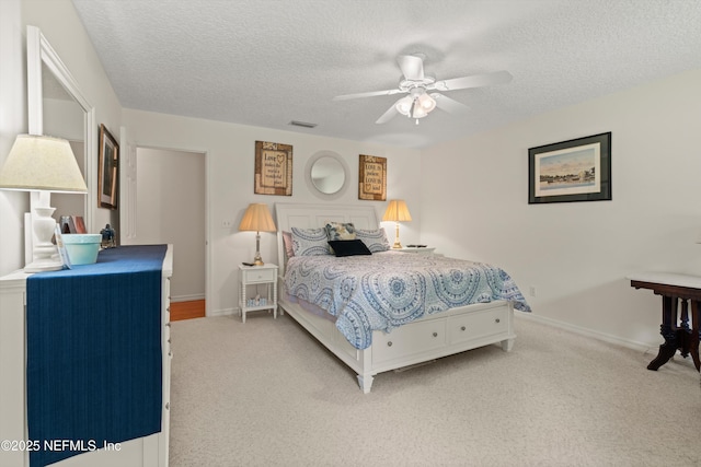 5566 Don Manuel Rd, Elkton, FL 32033 - bedroom with a textured ceiling, light colored carpet, and ceiling fan
