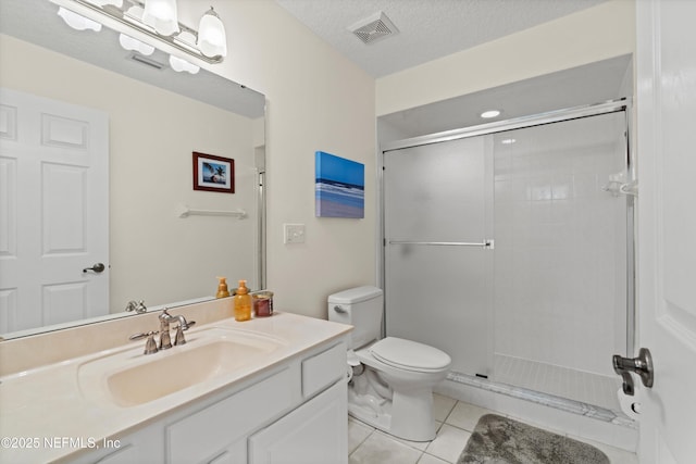 5566 Don Manuel Rd, Elkton, FL 32033 - bathroom with tile patterned floors, vanity, a stall shower, and a textured ceiling