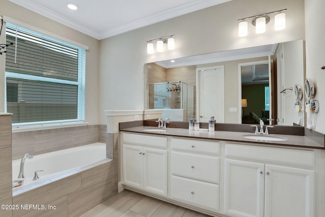 363 Latrobe Ave, Saint Augustine, FL 32095 - ensuite bathroom with double vanity, a stall shower, a bath, ornamental molding, and recessed lighting