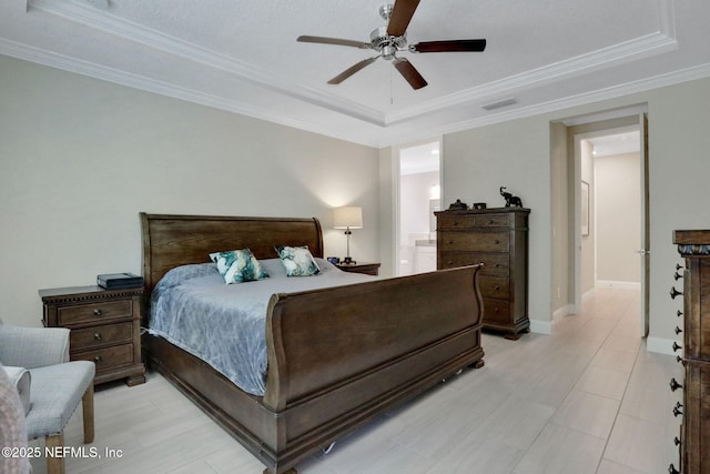 363 Latrobe Ave, Saint Augustine, FL 32095 - bedroom with a tray ceiling, ornamental molding, ensuite bathroom, and ceiling fan