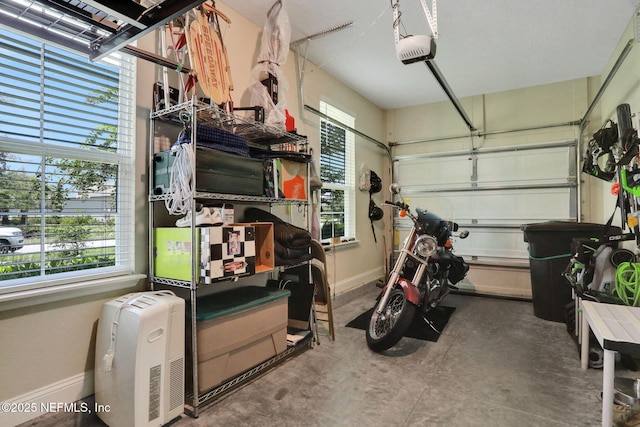 363 Latrobe Ave, Saint Augustine, FL 32095 - garage featuring baseboards and a garage door opener